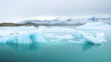 Jokulsarlon glacier Lagoon, Iceland. Stunning icebergs floating in lagoon, powerful message of climate change in Iceland. Perfect light and weather. High quality 4k footage.