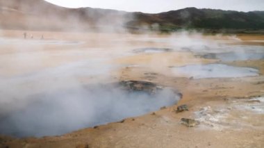 Namafjall geothermal area with a unique landscape of sulphuric steaming pools, mudpots and fumaroles, Iceland. Mars or Venus. High quality 4k footage. 