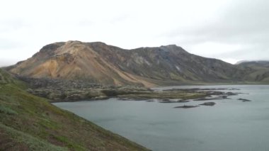 Iceland landscape with stunning mountains around Landmannalaugar. Iceland nature in a dramatic weather. Moss covered lava fields in Iceland. High quality 4k footage
