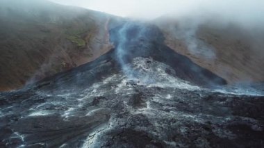 4K Aerial Drone footage of Cold Lava in Fagradalsfjall active volcano in Geldingadalir, Reykjanes, Iceland. River of Cold Lava Flowing down the hill. Lava field.