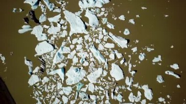 Aerial drone footage of Fjallsarlon glacier lagoon with plenty of icebergs floating in a lake, Iceland. Scenic view of Ice bergs. Artic nature ice landscape. Melting glacier in Iceland. Climate change