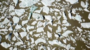 Aerial drone footage of Fjallsarlon glacier lagoon with plenty of icebergs floating in a lake, Iceland. Scenic view of Ice bergs. Artic nature ice landscape. Melting glacier in Iceland. Climate change