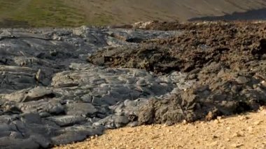 4K close-up footage of Cold Lava in Fagradalsfjall active volcano in Geldingadalir, Reykjanes, Iceland. River of Cold Lava Flowing down the hill.