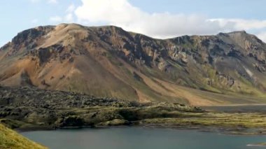 Iceland landscape with stunning mountains around Landmannalaugar. Iceland nature in a dramatic weather. Moss covered lava fields in Iceland. High quality 4k footage