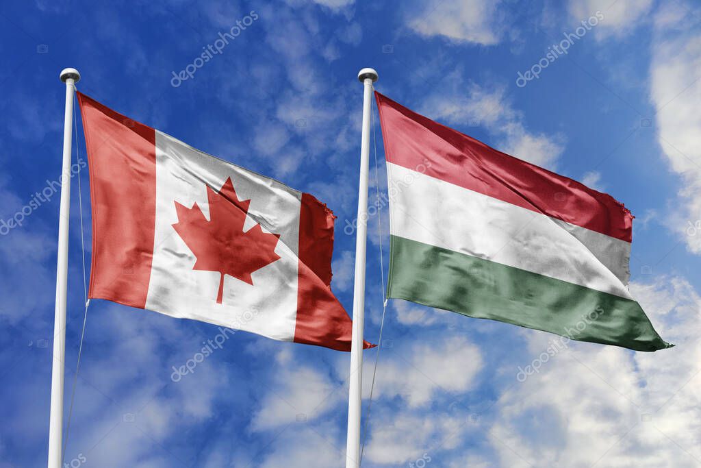 3d illustration. Canada and Hungary Flag waving in sky. High detailed waving flag. 3D render. Waving in sky. Flags fluttered in the cloudy sky.