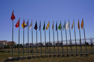 Flags of 16 Turkish states under the deep blue sky: Flags of 16 Turkish States behind the Great Turkish Flag, Unity and Diversity clipart