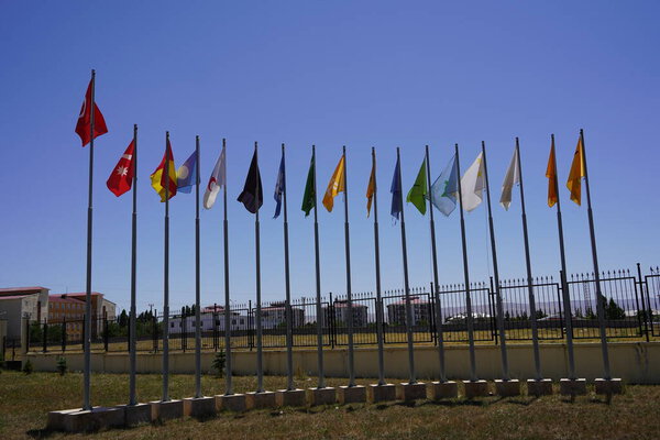 Flags of 16 Turkish states under the deep blue sky: Flags of 16 Turkish States behind the Great Turkish Flag, Unity and Diversity