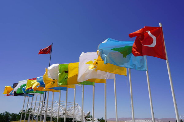 Flags of 16 Turkish states under the deep blue sky: Flags of 16 Turkish States behind the Great Turkish Flag, Unity and Diversity