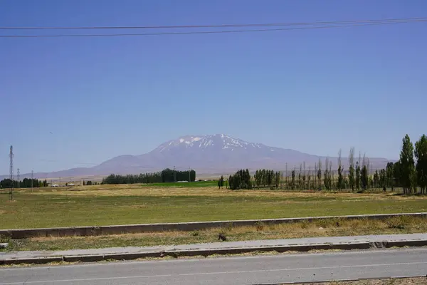 stock image Majestic Mount Sphan: Turkeys Dormant Stratovolcano Under Azure Skies.