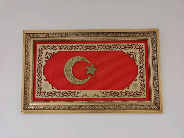 Stock image An ornate depiction of the Turkish crescent and star, framed in gold, symbolizing heritage, unity, and the enduring strength of the nation.