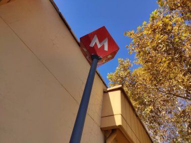 Ankara, Turkey, October 9, 2024, Metro sign towering above, symbolizing urban connectivity and efficient transportation. The vibrant red