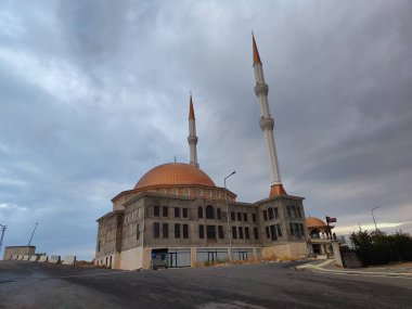 Turkiye, November 15, 2024, Majestic Mosque Under Stormy Skies: A Serene Symbol of Faith and Resilience Standing Tall Against Dark Clouds, with Twin Minarets Reaching for the Heavens. clipart