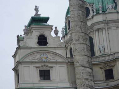 Vienna, Autria, April 3, 2013, Karlskirche: Majestic Baroque Cathedral in Vienna Standing Tall with its Iconic Green Dome and Twin Spiral Columns - A Symbol of Imperial Power Meets Divine Grace. clipart