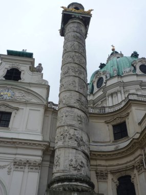 Vienna, Autria, April 3, 2013, Karlskirche: Majestic Baroque Cathedral in Vienna Standing Tall with its Iconic Green Dome and Twin Spiral Columns - A Symbol of Imperial Power Meets Divine Grace. clipart