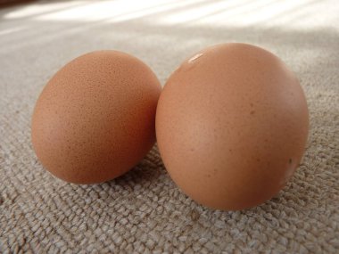 Brown Eggs on a Soft Fabric Surface: A Natural and Inviting Food Photography clipart