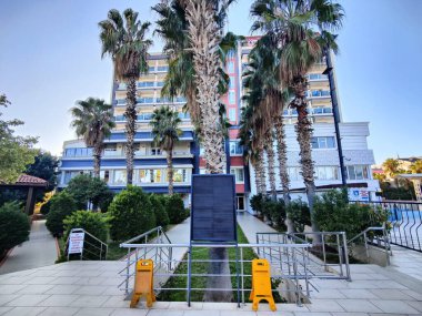 Antalya, Turkey, December 18, 2024, Antalya Teachers' Lodge: A Modern Accommodation Surrounded by Palm Trees for a Peaceful Stay. clipart