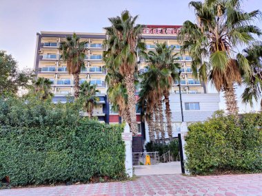 Antalya, Turkey, December 18, 2024, Antalya Teachers' Lodge: A Modern Accommodation Surrounded by Palm Trees for a Peaceful Stay. clipart