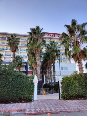 Antalya, Turkey, December 18, 2024, Antalya Teachers' Lodge: A Modern Accommodation Surrounded by Palm Trees for a Peaceful Stay. clipart