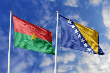 Burkina Faso ve Bosna-Hersek 'in Bayrakları Mavi Gökyüzüne Karşı Birlikte Dalgalanıyor, Diplomatik İlişkiler ve Kıtalararası İlişkileri simgeliyor