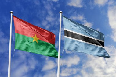 Bir Burkina Faso ve Botswana bayrağı, Güney Afrika birliği için bir metafor, mavi gökyüzüne karşı birlikte dalgalanıyor, dostluğu ve kültürel değişimi simgeliyor..