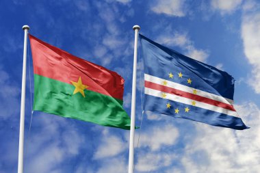 Bir Burkina Faso ve Cape Verde bayrağı, Batı Afrika birliği için bir metafor, mavi gökyüzüne karşı birlikte el sallayarak dostluğu ve kültürel değişimi sembolize ediyor..