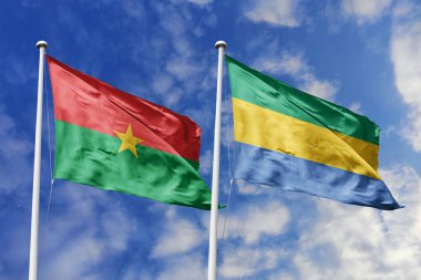 Burkina Faso ve Gabon 'un Bayrakları Mavi Gökyüzüne Karşı Birlikte Dalgalanıyor, Afrika Birliği ve Diplomatik İlişkileri simgeliyor