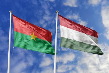 Burkina Faso ve Macaristan 'ın Bayrakları Mavi Gökyüzüne Karşı Birlikte Dalgalanıyor, Diplomatik İlişkileri ve Küresel Bağlantıları simgeliyor
