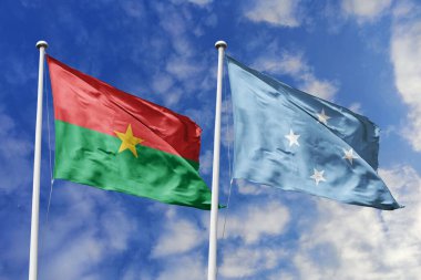 Bir Burkina Faso ve Mikronezya bayrağı, Pasifik-Afrika birliği için bir metafor, mavi gökyüzüne karşı birlikte dalgalanıyor, dostluğu ve kültürel değişimi simgeliyor..