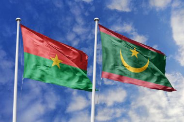 Bir Burkina Faso ve Moritanya bayrağı, Batı Afrika birliği için bir metafor, mavi gökyüzüne karşı birlikte el sallayarak dostluğu ve kültürel değişimi sembolize ediyor..