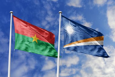 Bir Burkina Faso ve Marshall Adaları bayrağı, Pasifik-Afrika birliği için bir metafor, mavi gökyüzüne karşı birlikte dalgalanıyor, dostluğu ve kültürel değişimi simgeliyor..