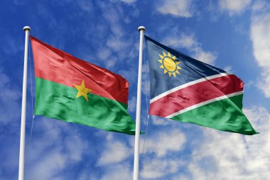 Bir Burkina Faso ve Namibya bayrağı, Güney Afrika birliği için bir metafor, mavi gökyüzüne karşı birlikte dalgalanıyor, dostluğu ve kültürel değişimi simgeliyor..