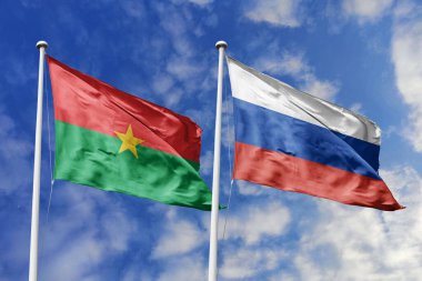 Bir Burkina Faso ve Rusya bayrağı, Doğu-Batı işbirliğinin bir metaforu, mavi gökyüzüne karşı el sallayarak dostluğu ve kültürel değişimi sembolize ediyor..