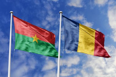 Bir Burkina Faso ve Romanya bayrağı, Avrupa-Afrika ilişkilerinin bir metaforu, dostluğu ve kültürel değişimi simgeleyen mavi gökyüzüne karşı el sallıyor.