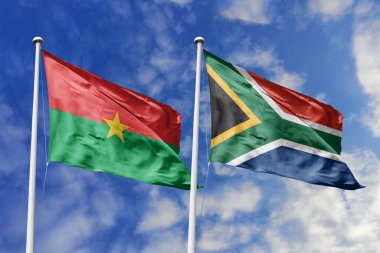 Bir Burkina Faso ve Güney Afrika bayrağı, Güney Afrika birliği için bir metafor, mavi gökyüzüne karşı birlikte dalgalanıyor, dostluğu ve kültürel değişimi simgeliyor..