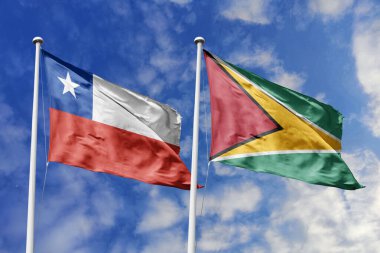 Şili ve Guyana Bayrakları Parlak Mavi Gökyüzüne Karşı Dalgalanıyor, İkili İlişkiler ve Güney Amerika Birliğini simgeliyor