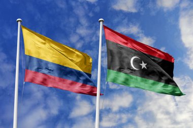 Kolombiya ve Libya bayrakları uluslararası ilişkiler, dostluk ve kültür alışverişini simgeleyen gururla birlikte dalgalanıyor.