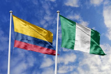 Kolombiya ve Nijerya bayrakları gururla el sallayarak uluslararası ilişkileri, dostluğu ve kültürel değişimi simgeliyor..