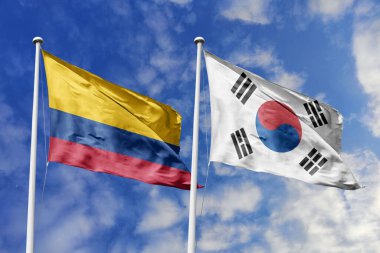 Colombia and South Korea Flags Waving Together Against a Dynamic Sky