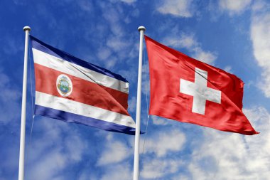 Kosta Rika ve İsviçre Ulusal Bayrakları Mavi Gökyüzü Altında Gururla Dalgalanıyor Diplomatik İlişkiler ve Küresel Dostluğu simgeliyor.