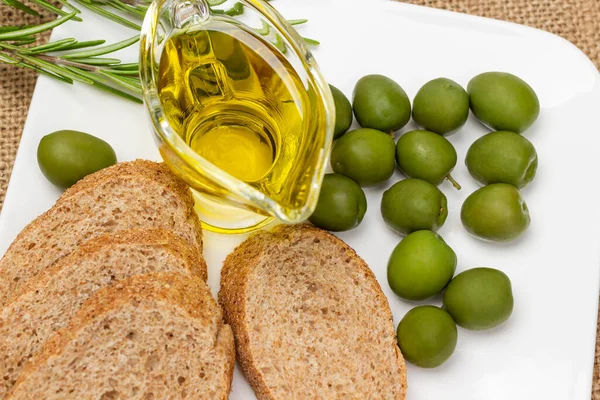 Green Olives Bowl Olive Oil Baguette Pieces White Plate Flat — Stock Photo, Image