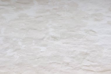 Doğal arka plan. Eski, beyaz bir duvar. Bej rengi.