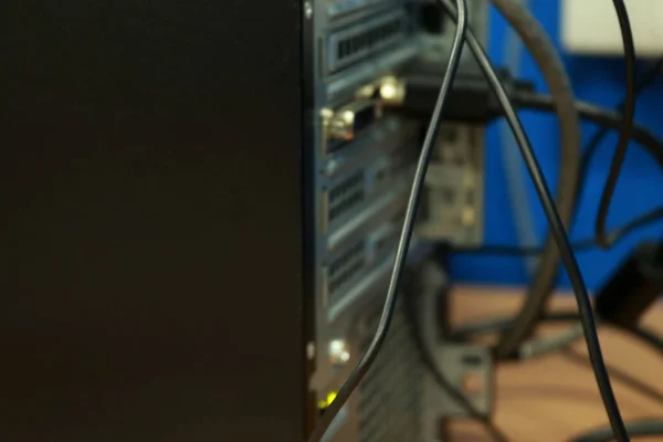 Stock image The back of a personal computer full of ports and connections