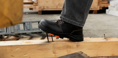 Safety shoes are strong shoes because they are not penetrated by nails and other dangerous objects clipart