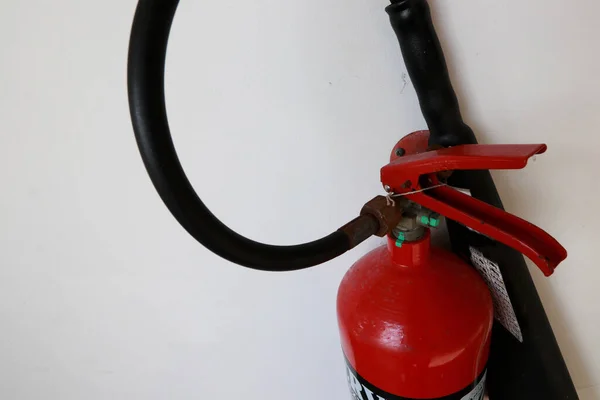 A fire extinguisher is an active fire protection device used to extinguish or control small fires, often in emergency situations. can also be called a small extinguisher for indoor
