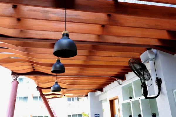 stock image Interior design of a backyard of a house that looks like a bar or cafe with lots of lights above it