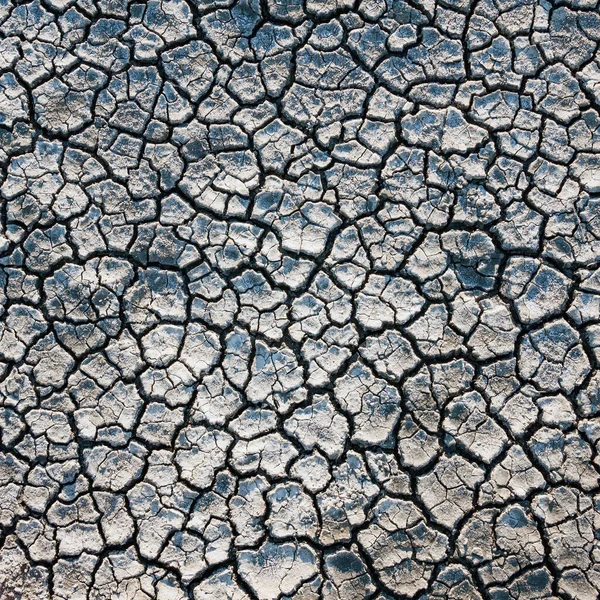 割れた地球の土壌の背景 — ストック写真