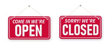 Information boards with Come in were open and Sorry, We are closed. White signboard with a rope on background. Business concept for closed and open businesses, sites and services.