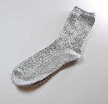 a grey color Socks on white background