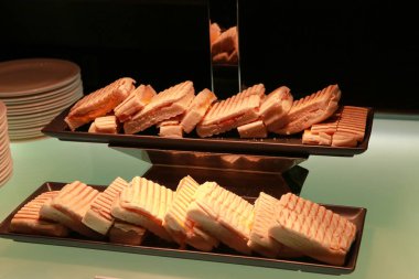 A stack of sliced bread toasts on plate