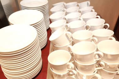 with hot water and cups for afternoon tea on the wood table